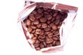 Coffee beans in aluminum foil bag package Royalty Free Stock Photo