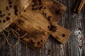 coffee beans, anise and cinnamon sticks on a brown wooden board Royalty Free Stock Photo