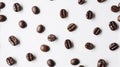 Coffee beans artfully arranged on the white background create a mesmerizing pattern