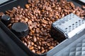 Coffee beans in the automatic coffee grinder Royalty Free Stock Photo