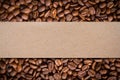 Coffee beans background with blank brown paper label Royalty Free Stock Photo