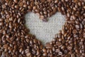Coffee beans background with burlap heart frame Royalty Free Stock Photo