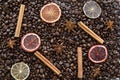 Coffee beans background, dried slices of orange and cinnamon sticks background. Royalty Free Stock Photo