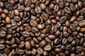 Coffee beans background. Food texture, roasted fragrant appetizing brown arabica beans