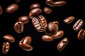 Coffee beans background. Roasted falling or flying coffee beans on black background. Royalty Free Stock Photo