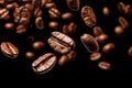 Coffee beans background. Roasted falling or flying coffee beans on black background. Royalty Free Stock Photo