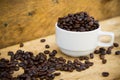 Coffee beans background on wooden, Fresh coffee beans with coffee cup on wooden background, Drinking set background