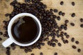 Coffee beans background on wooden, Fresh coffee beans with coffee cup on wooden background, Drinking set background