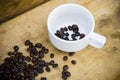 Coffee beans background on wooden, Fresh coffee beans with coffee cup on wooden background, Drinking set background