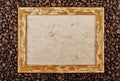 Coffee beans background with wooden picture frame. Top view with copy space Royalty Free Stock Photo