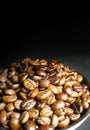 Coffee beans in a black bowl on black background Royalty Free Stock Photo