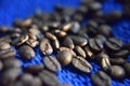 Coffee beans on the blue background close-up Royalty Free Stock Photo