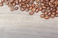 Coffee beans border on old oak table. Royalty Free Stock Photo