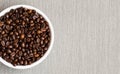 Coffee beans. Bowl of Aromatic Coffee on grey background, close-up. Flat lay Royalty Free Stock Photo