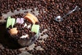 Coffee beans and a bowl of macarons Royalty Free Stock Photo