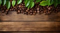 Coffee beans in a brown wooden background and with coffee leaves in the form of damaged and weathered surfaces use of general