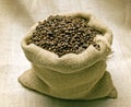 Coffee Beans In Burlap Bag Lit Overhead Royalty Free Stock Photo