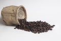 Coffee beans in burlap bag on white background Royalty Free Stock Photo
