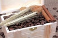 Coffee beans cinnamon nuts in a wooden box Royalty Free Stock Photo