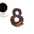 Coffee beans with cinnamon on a white background, cup of coffee March 8