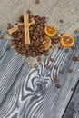 Coffee beans on coarse linen and spices. On a surface of brushed pine boards painted black and white Royalty Free Stock Photo