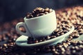 Coffee beans. Coffee cup full of coffee beans. Toned image Royalty Free Stock Photo