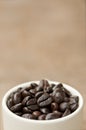 Coffee beans in cup