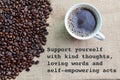 Coffee beans and a cup of coffee with phrase SUPPORT YOURSELF WITH KIND THOUGHTS, LOVING WORDS AND SELF-EMPOWERING ACTS