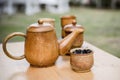 Coffee beans, cup of coffee and teapot on wooden desk. Set of ca Royalty Free Stock Photo