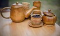 Coffee beans, cup of coffee and teapot on wooden desk. Royalty Free Stock Photo