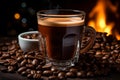 coffee beans and a cup of coffee in front of the fireplace banco de imagens