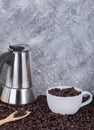 Coffee beans in cup with geyser coffee maker Royalty Free Stock Photo