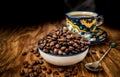 Coffee beans with cup and saucer