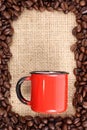 Coffee beans and cup on sizal sack Royalty Free Stock Photo