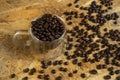 A Cup of coffee beans on wooden table, Top view with copy space for your text