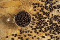 A Cup of coffee beans on wooden table