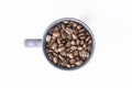 Coffee beans in dark coffee cup on isolated white background Royalty Free Stock Photo