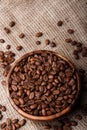 Coffee beans in dish on bag Royalty Free Stock Photo