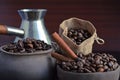 Coffee beans in an earthenware dish and a bag. Royalty Free Stock Photo