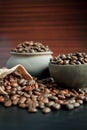 Coffee beans in an earthenware dish and a bag. Royalty Free Stock Photo