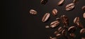 Coffee beans falling on brown background, closeup view Royalty Free Stock Photo