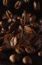 Coffee beans falling on ground coffee on the table. The aroma of roasted arabica and robusna coffee beans. Dark background and Royalty Free Stock Photo
