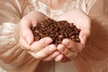 Coffee beans in female hands