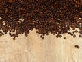 Coffee beans on fine oak tree wood texture pattern background. Space for text.