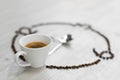Coffee beans folded in the form of a clock. Instead of the number 9, a cup of coffee, which means it`s time to drink coffee Royalty Free Stock Photo