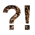 Coffee beans font. Exclamation and question marks is cut out of paper on the background of roasted beans of excellent coffee. Set