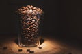 Coffee beans in glass cup on black background Royalty Free Stock Photo