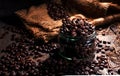 Coffee beans in a glass jar, black background Royalty Free Stock Photo