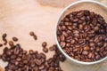 Coffee beans in a glass jar on wooden background, close up, top view. Coffee beans Royalty Free Stock Photo