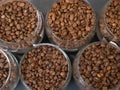 Coffee beans in glass jars standing in rows top view Royalty Free Stock Photo